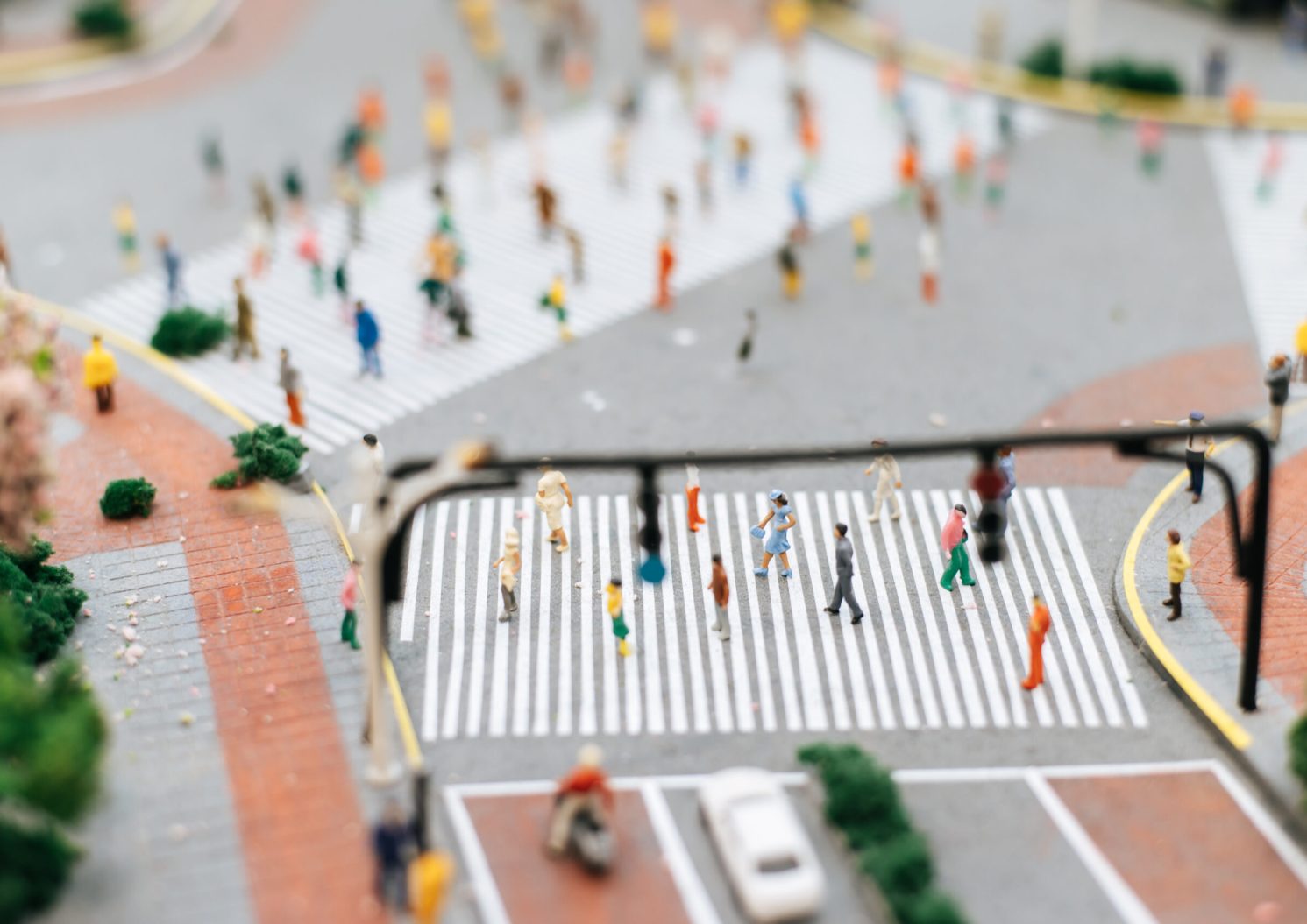 Small people or people medel walk on many streets. Selective focus